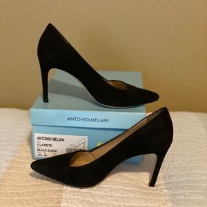 Antonio Melani slanted pointed toe suede pumps.